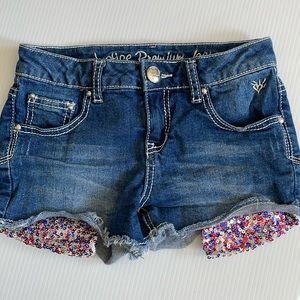 Justice denim jean shorts with red, blue & silver sequins. Girls size 10